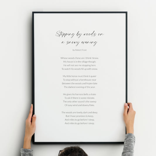 Single portrait typography print featuring the poem Stopping By Woods On A Snowy Evening by Robert Frost. The title is in an elegant script font, with the body copy in a crisp sans serif content. All text is black on a white background.