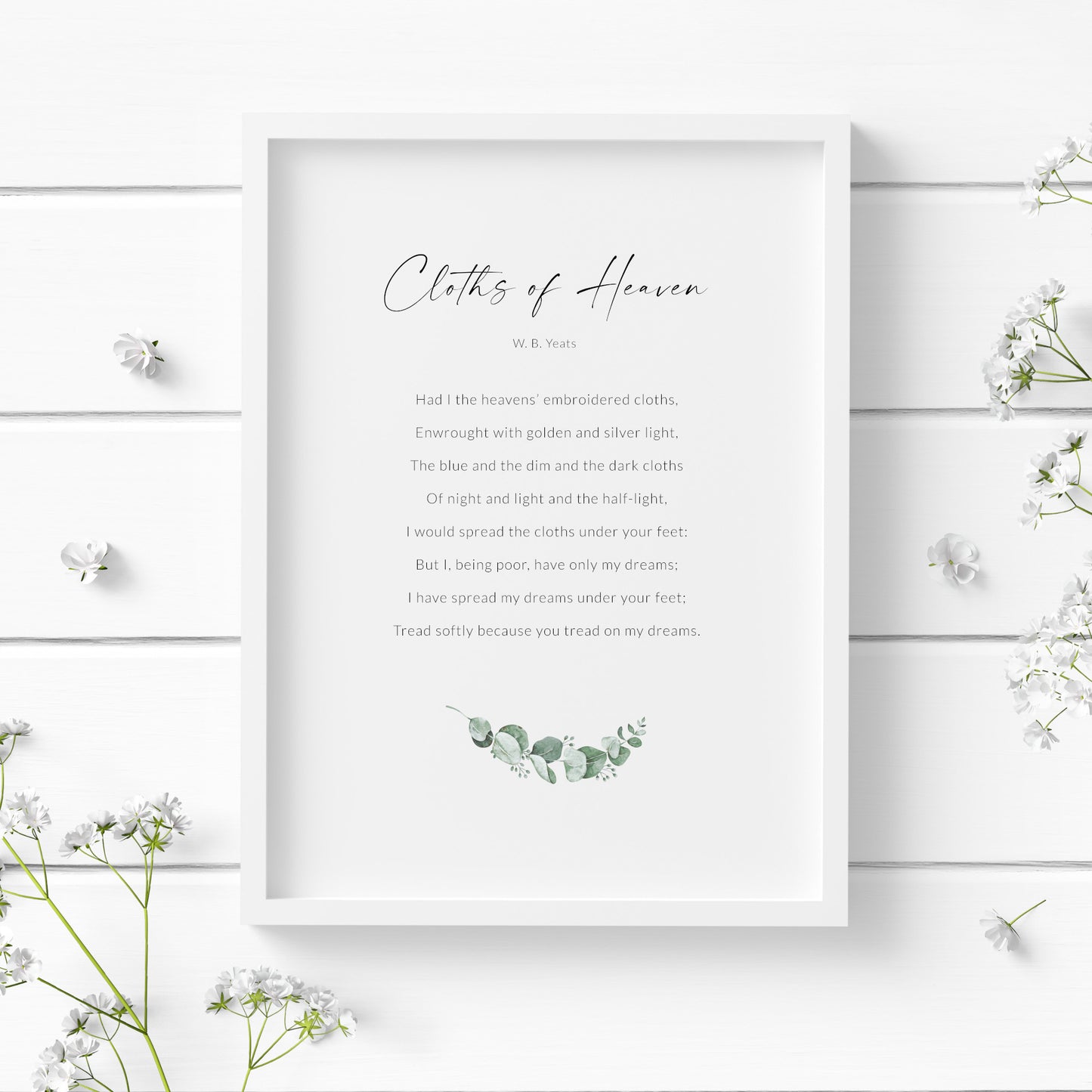 Single portait print of the poem Cloths of Heaven by W. B. Yeats. Title is in a modern script font, with the attribution and body text in a crisp sans serif font. A small image of eucalyptus is below the text. Text is black on a white background.