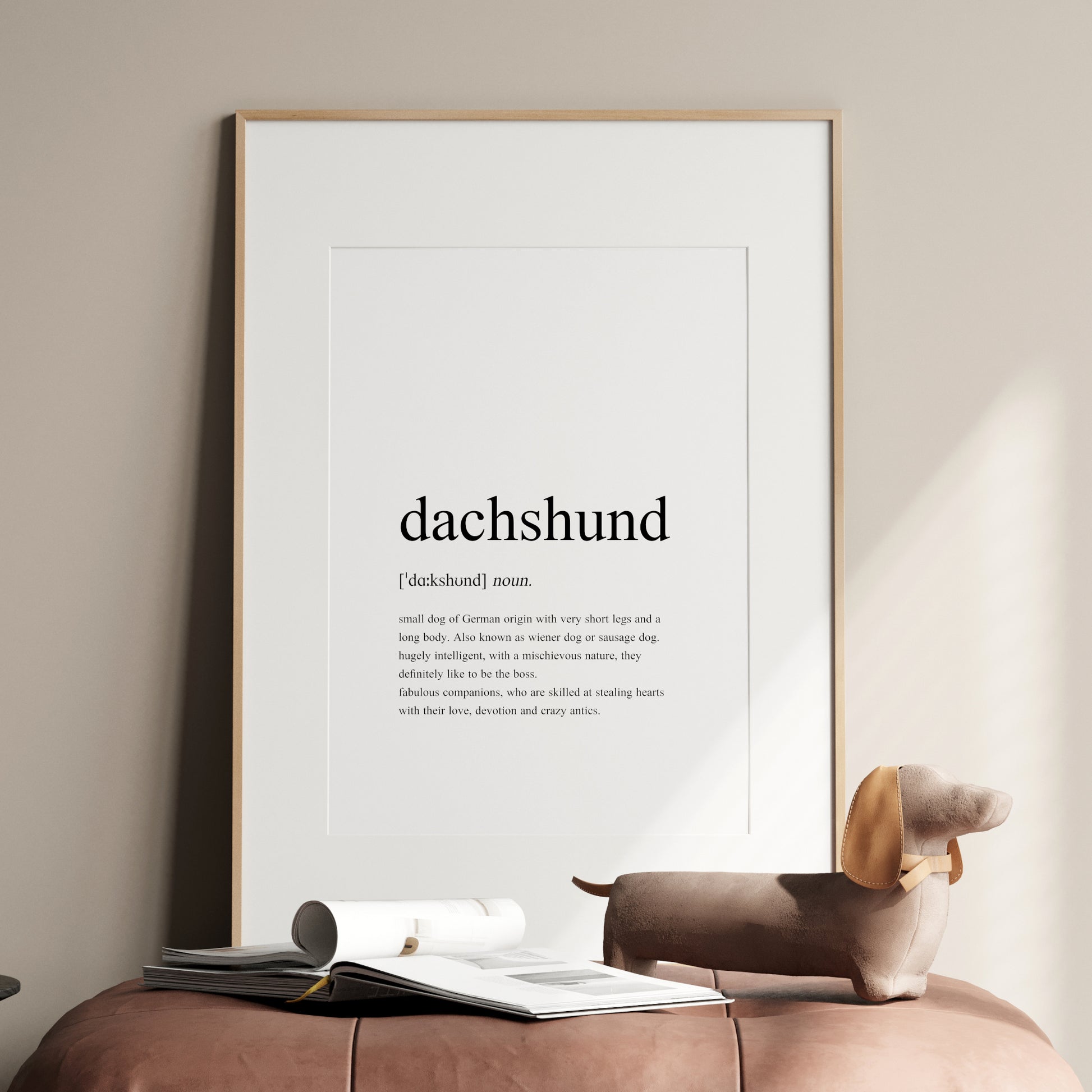 Dachshund definition print shown in a black frame. Styled as per a traditional dictionary definition, including the pronunciation and description. Text is factual, fun and sentimental about dachshunds. See the product description for the full text.