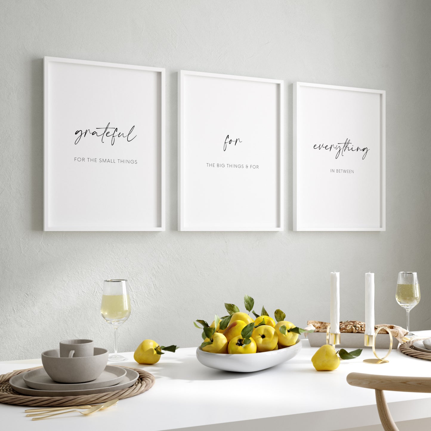 Set of 3 portrait typography prints shown in a dining room setting. Text across the 3 reads: grateful for the small things for the big things & for everything in between. The words grateful for everything are highlighted in an elegant script font.