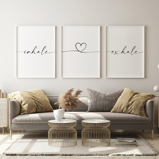 Set of 3 portrait typography prints featuring the words inhale exhale, linked together via a heart outline in the centre print. Text and heart outline are in a modern script font, with trailling edges, so that the prints appear to be joined in a single line.