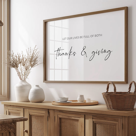 Single landscape typography print. Black text on a white background reads: Let our lives be full of both thanks & giving. The words thanks & giving are prominent and in a modern script font. Other text is in a small upper case sans serif font.