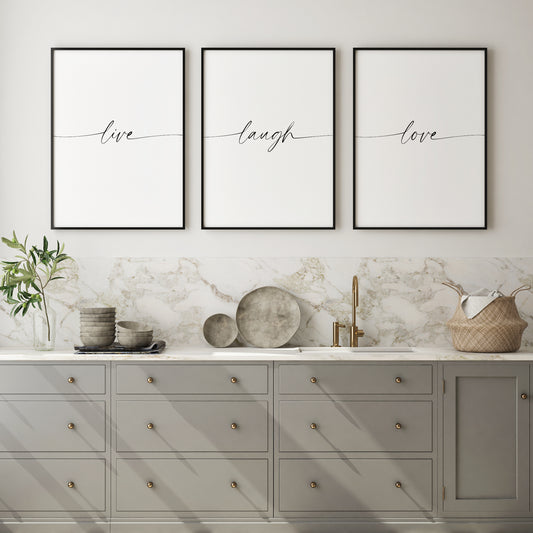 Set of 3 portrait typography prints featuring the quote: live laugh love. All text is in an elegant script font. The first and last letters of each word stretch to the edges implying connectedness. Text is black on a white background.