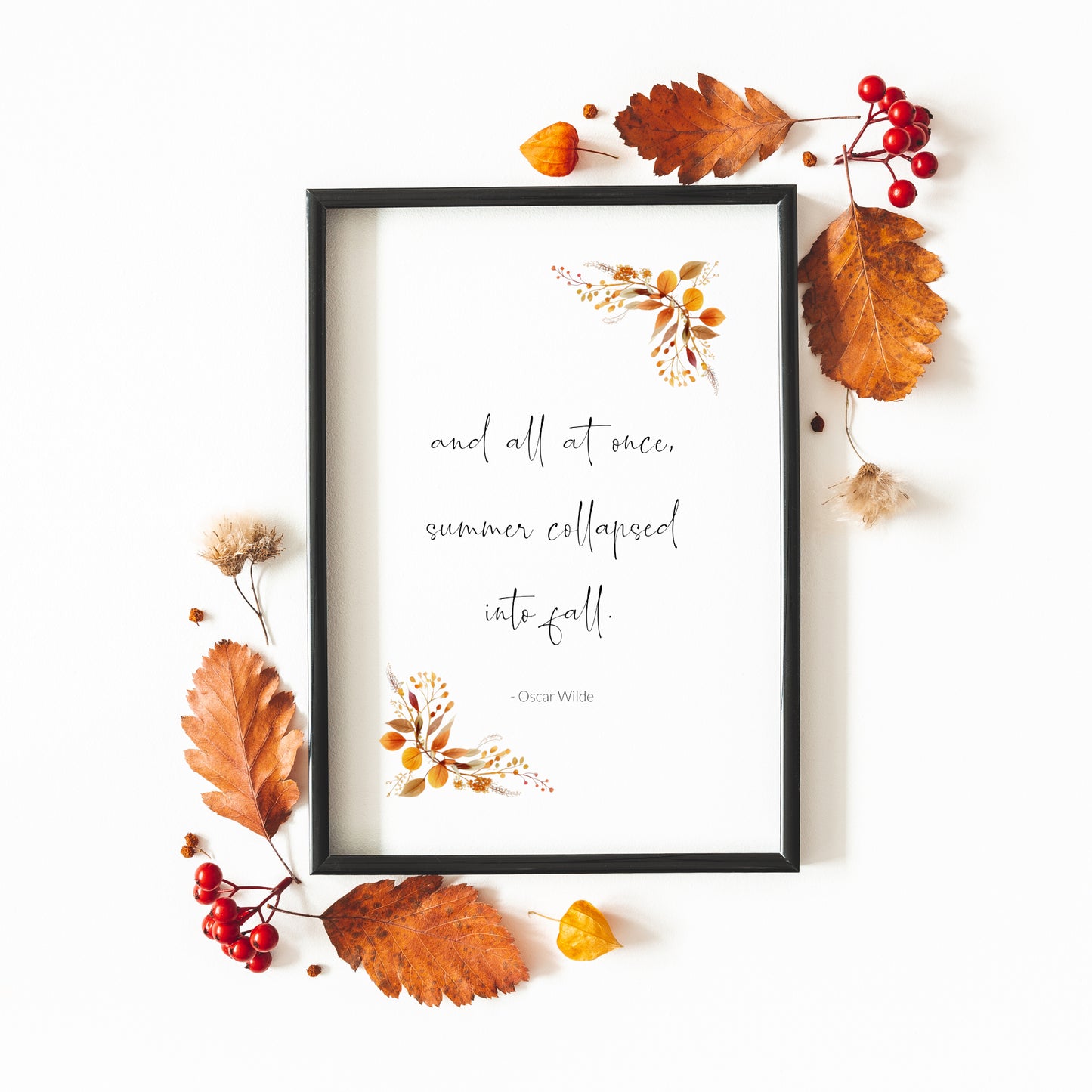 Single portrait print featuring the following quote by Oscar Wilde: and all at once, summer collapsed into fall. The quote is in a contemporary script font, with the attribution in a simple sans serif font. Autumnal foliage complements that quote.