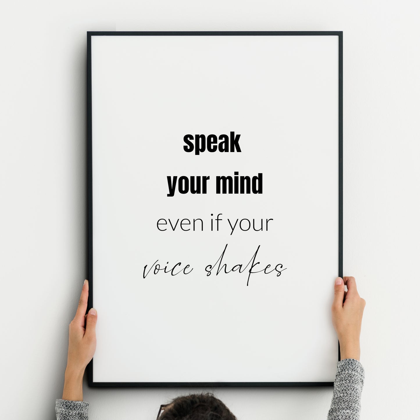 Single portrait typography print (black text). Text reads: Speak your mind even if your voice shakes. The words "speak your mind" are emphasised in bold. The words "voice shakes" are in a modern script. Other text is lower case sans serif.