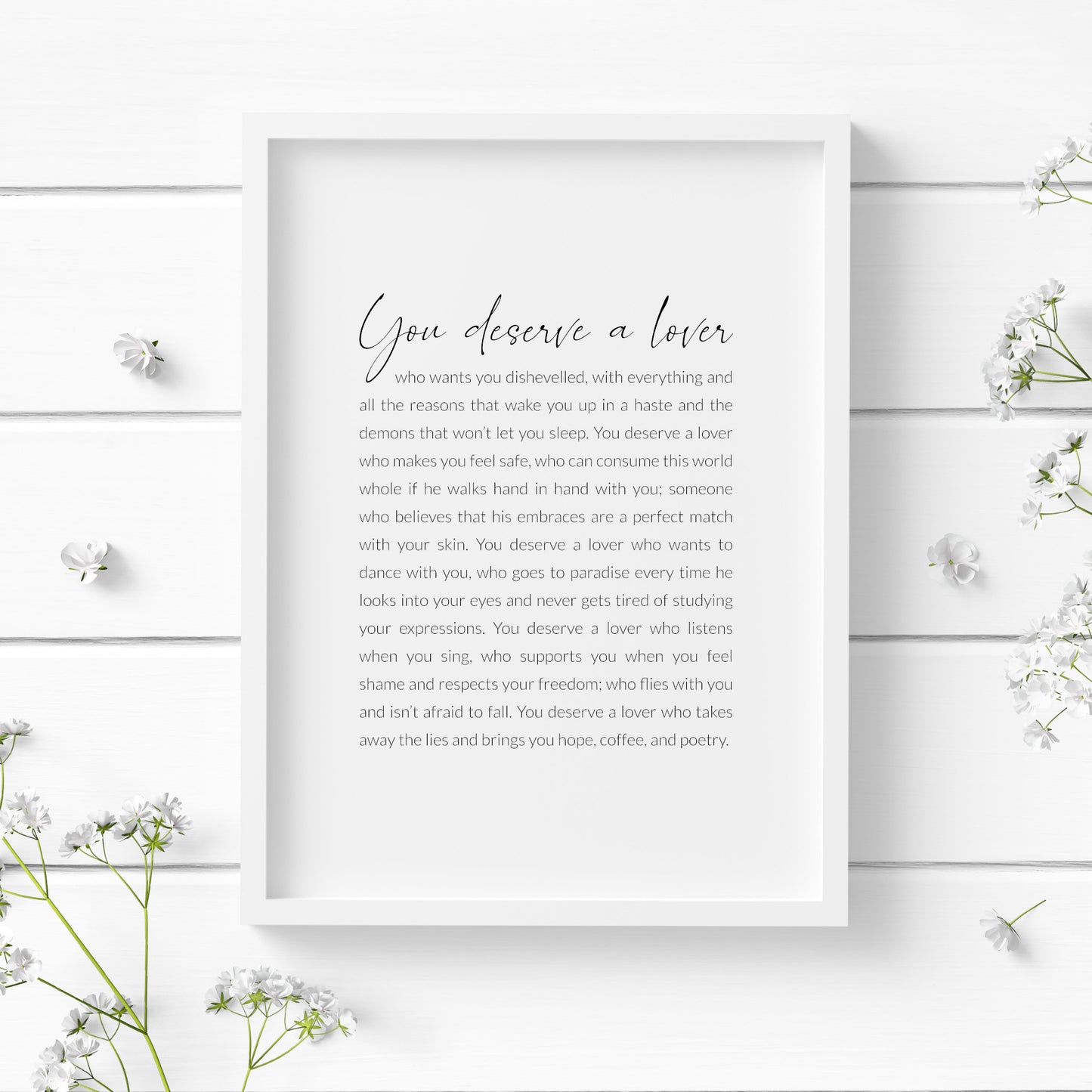 Single portrait typography print featuring a poem by Frida Kahlo that begins "You deserve a lover". Text is black on a white background, with the title in a contemporary script font and the remaining text in a crisp sans serif font.