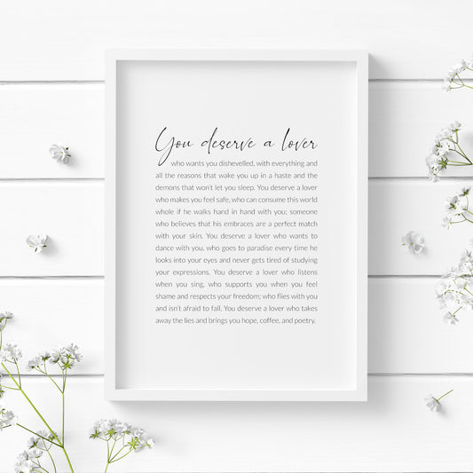 Single portrait typography print featuring a poem by Frida Kahlo that begins "You deserve a lover". Text is black on a white background, with the title in a contemporary script font and the remaining text in a crisp sans serif font.