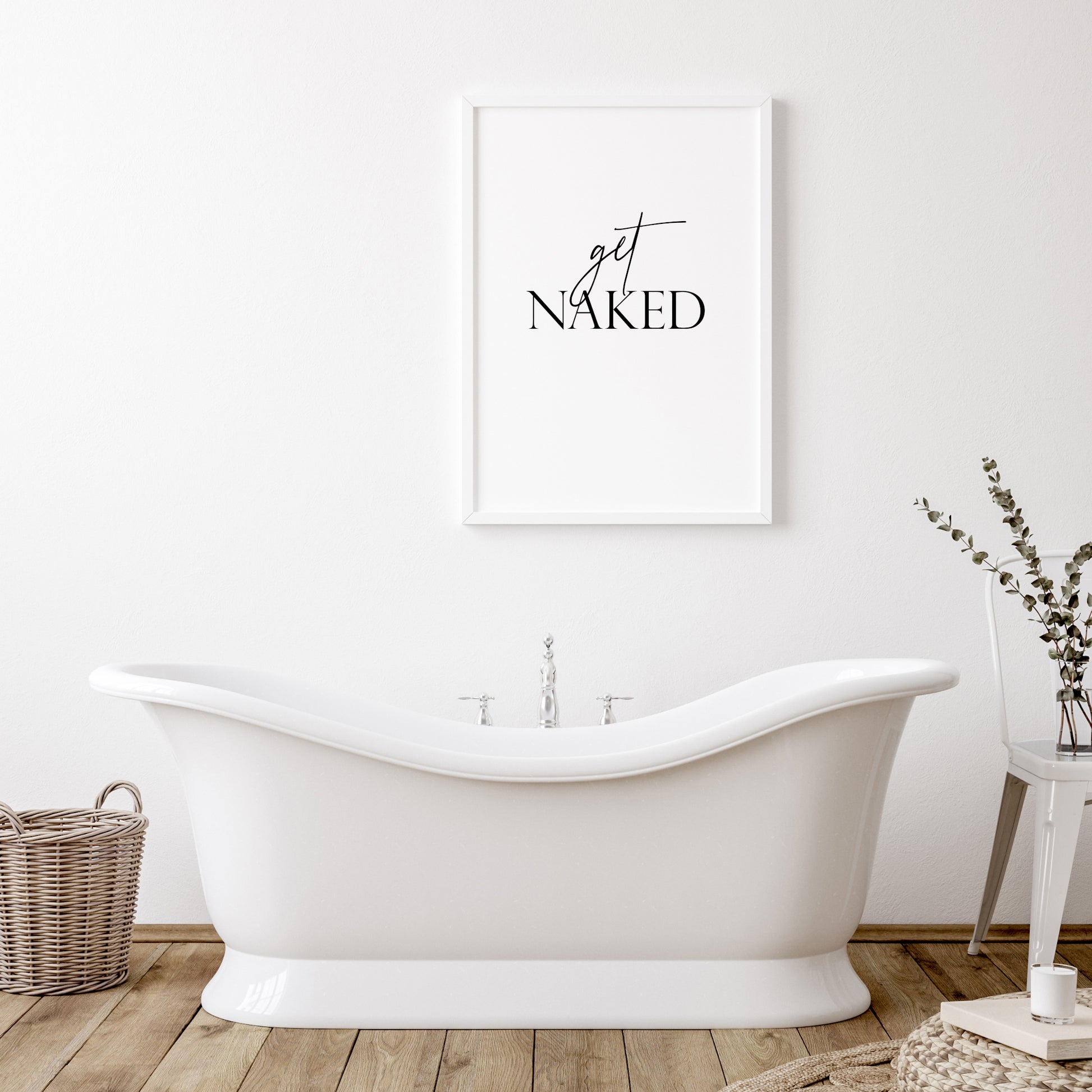 Single portrait typography print shown in a bathroom setting. Quote reads: get naked. The word "get" is in a stylish script font, contrasting with the upper case serif font used for the word "naked". Text is black on a white background.