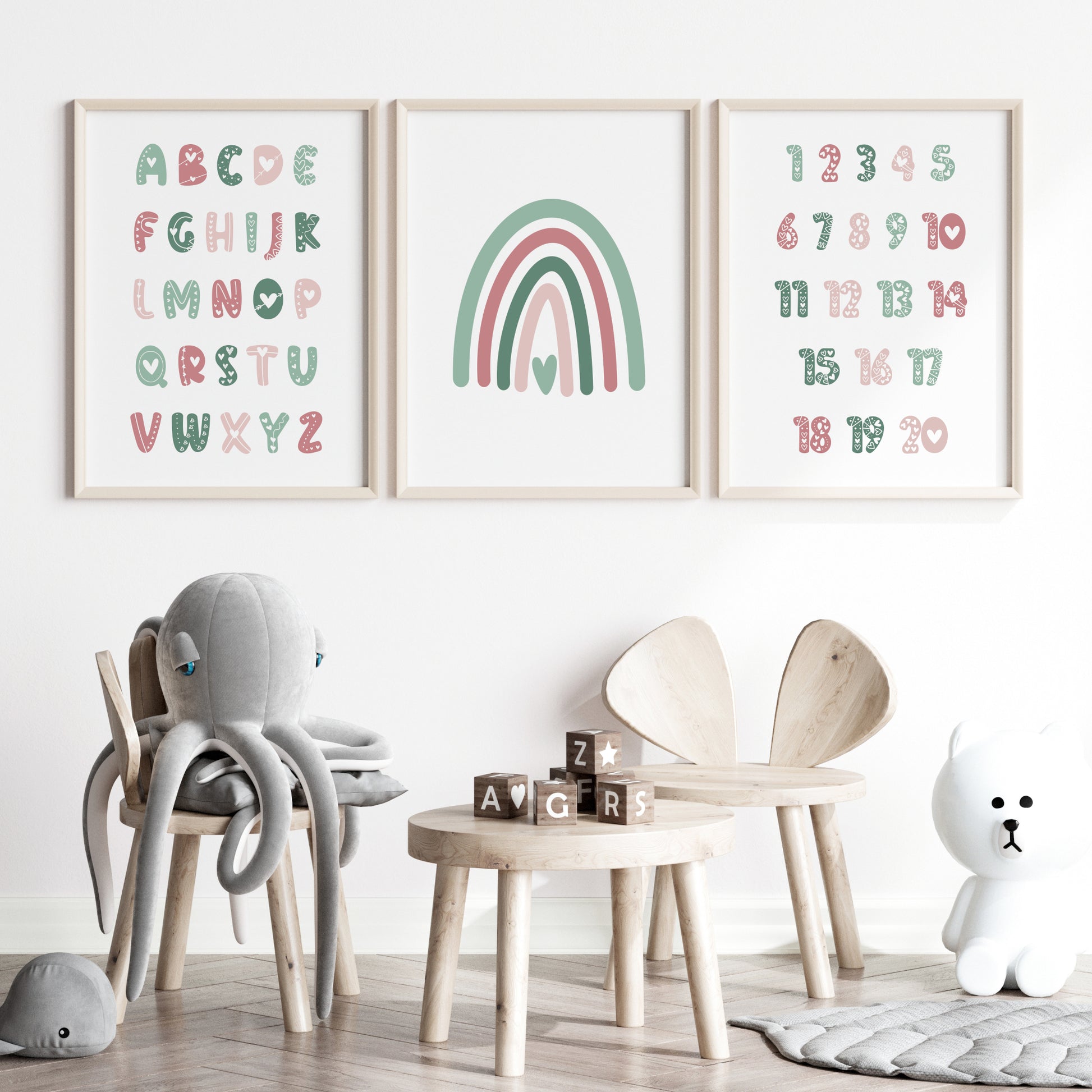 Set of 3 prints for a nursery or a child’s bedroom. Print 1 features the alphabet, print 2 a rainbow and print 3 numbers 1 to 30. All text is in a cute bubble-style font embellished with heart-themed doodles. Colour palette is shades of green and pink.