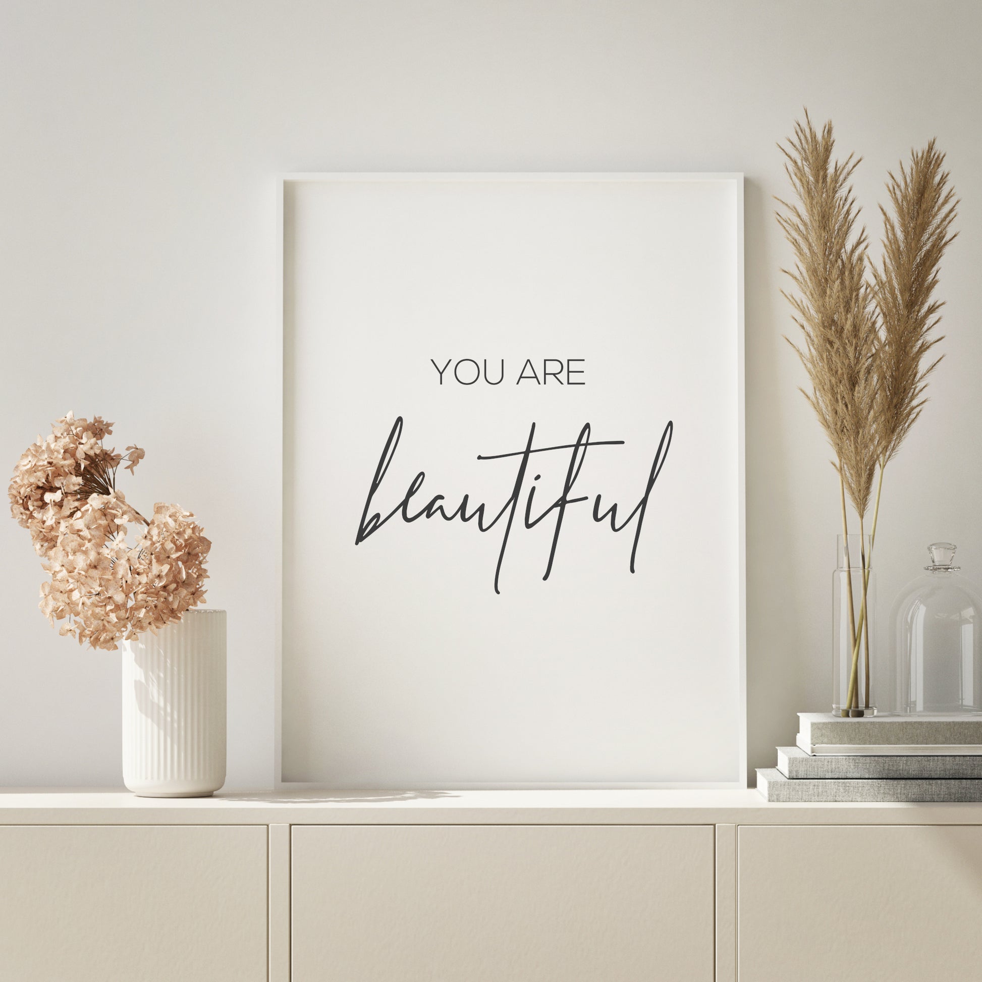 Single portrait typography print. Text reads: You are beautiful. The word "beautiful" is displayed prominently in an elegant script font. Text is black on a white background.