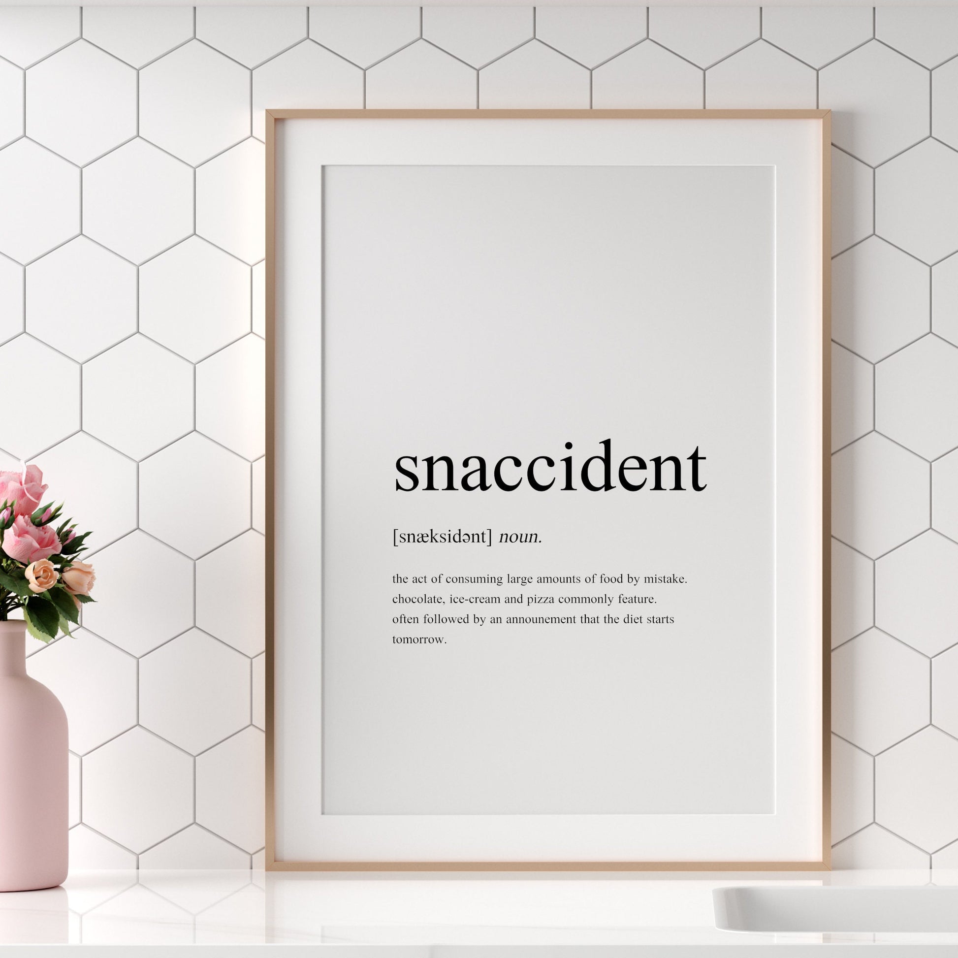 Single portrait typography print showing a humorous definition of the word snaccident in a traditional dictionary-style. Text is black on a white background.