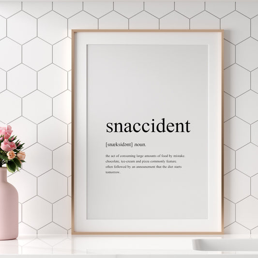 Single portrait typography print showing a humorous definition of the word snaccident in a traditional dictionary-style. Text is black on a white background.