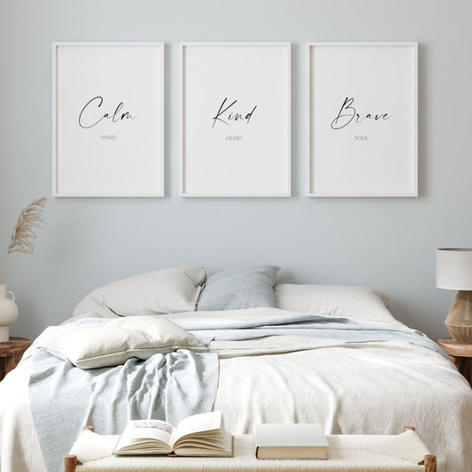 Set of 3 portrait typography posters displayed side by side. The quote "Calm mind, Kind heart, Brave soul" is split across them. The words Calm, Kind and Brave are in a large script front, with the other text in a smaller simple font below.