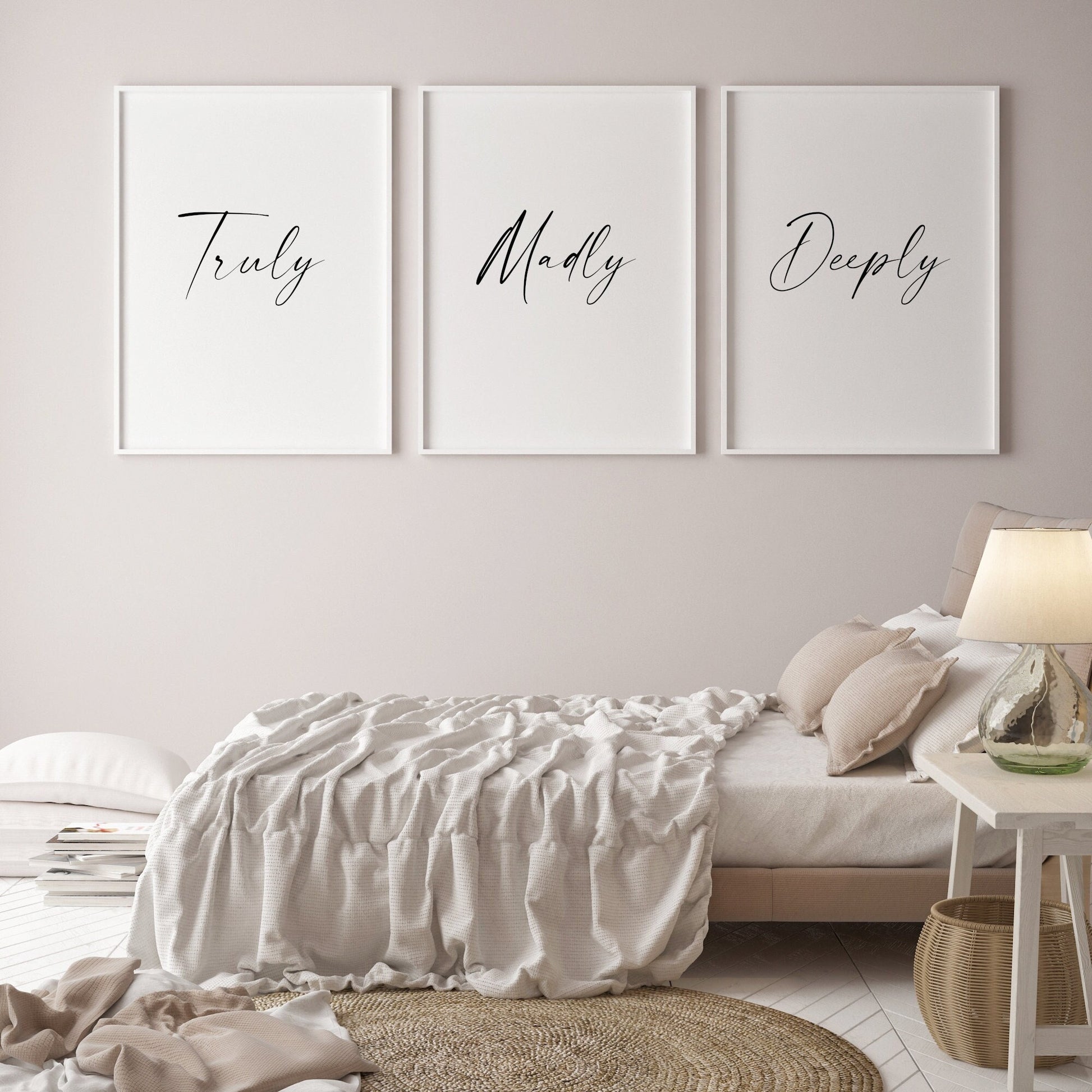 Set of 3 portrait typography prints positioned side by side. Text across the 3 reads: Truly Madly Deeply. All text is in a striking script font, black on a white background.