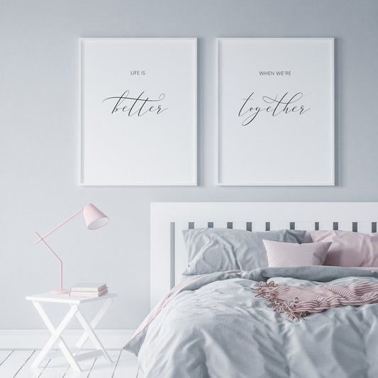 Set of 2 portrait typography prints. Quote across them reads: Life is better when we're together. The words better and together are positioned prominently in an elegant script font, so the phrase better together can be read independently.