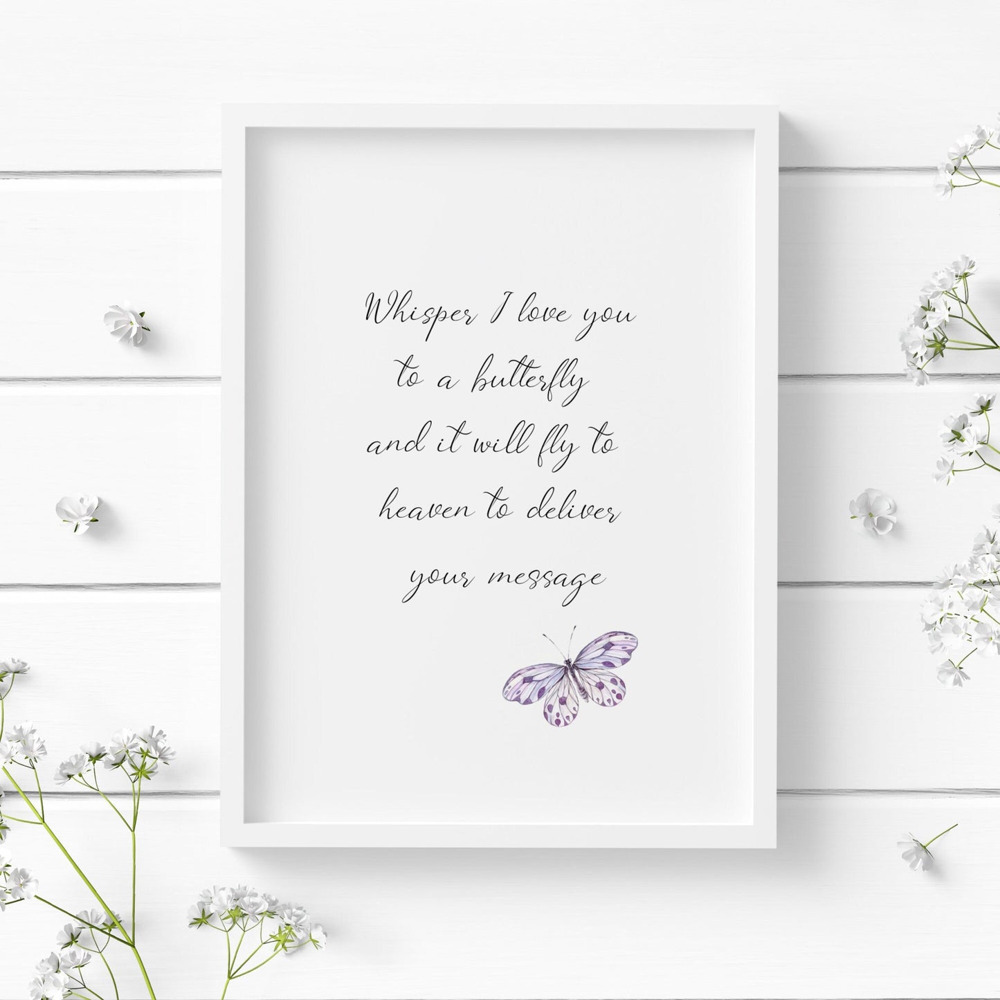 Single portrait typography print. Text reads: Whisper I love you to a butterfly and it will fly to heaven to deliver your message. Text is in an elegant script font, black on a white background. A small purple butterfly sits to the bottom right.