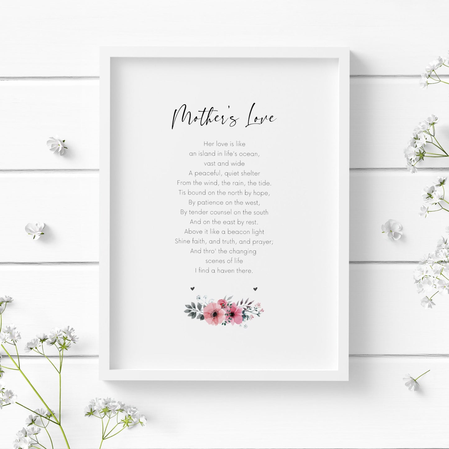 Single portrait print displayed in a white frame. The print features a poem entitled Mother's Love. The title is shown in an elegant script font, with the body in a simple, clear sans serif font. Below the text is a floral ornament in shades of pink and grey.