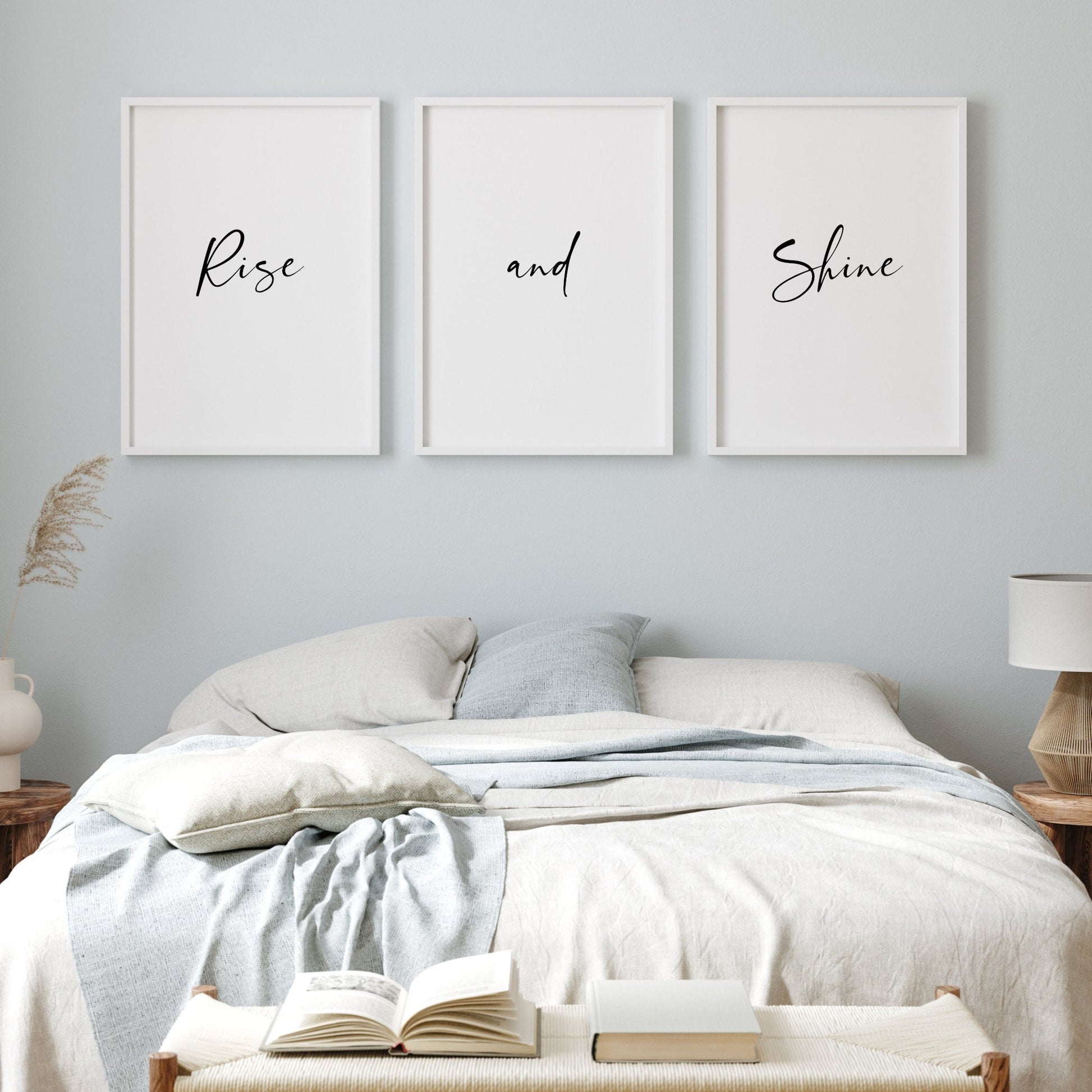 Set of 3 portrait typography prints. The phrase rise and shine is split across the three. All text is black on a white background and in an elegant script font.