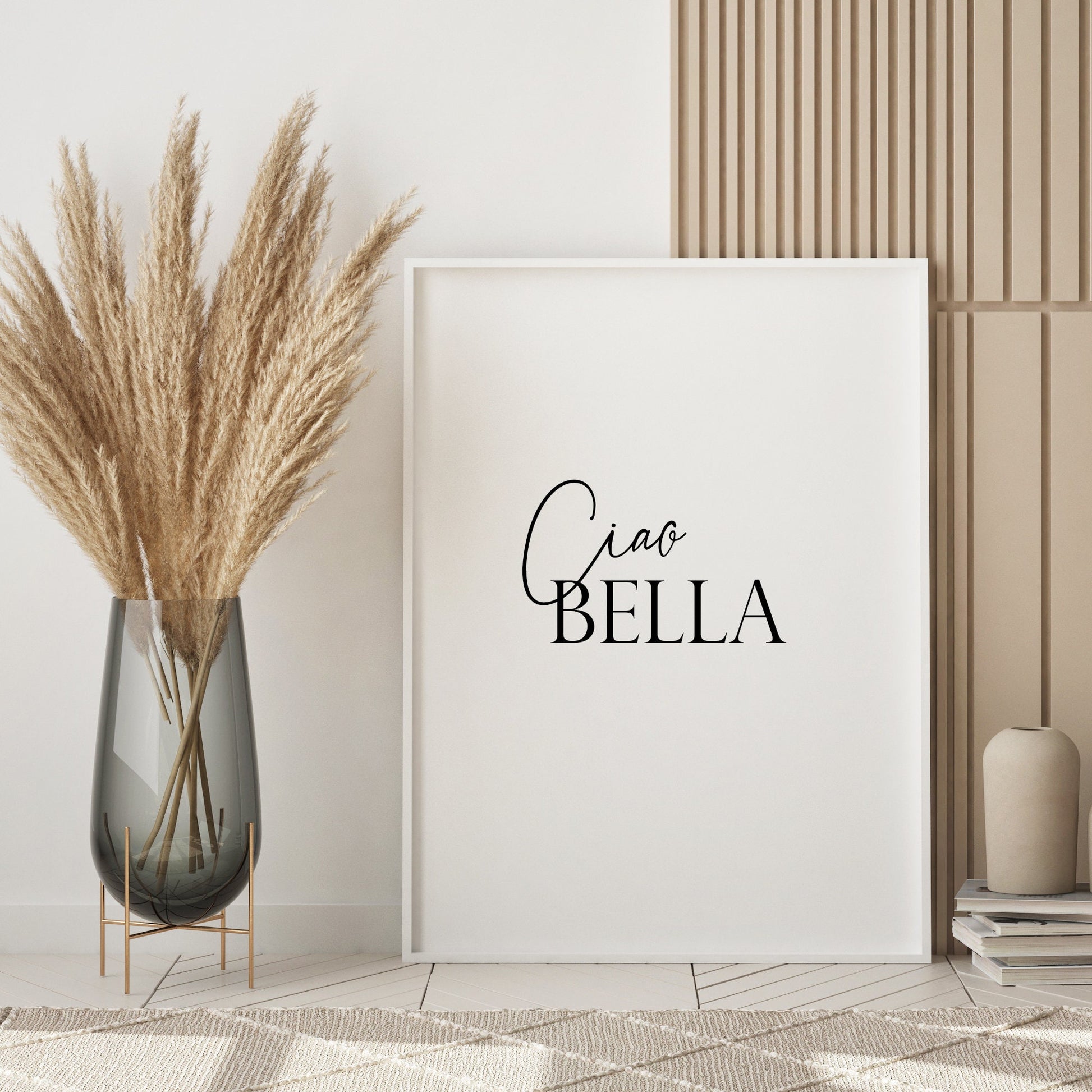 Single portrait typography print. Quote reads: Ciao Bella. The word Ciao is in an elegant script font, position to the top left of the word Bella, which is in a formal upper case serif font. All text is black on a white background.