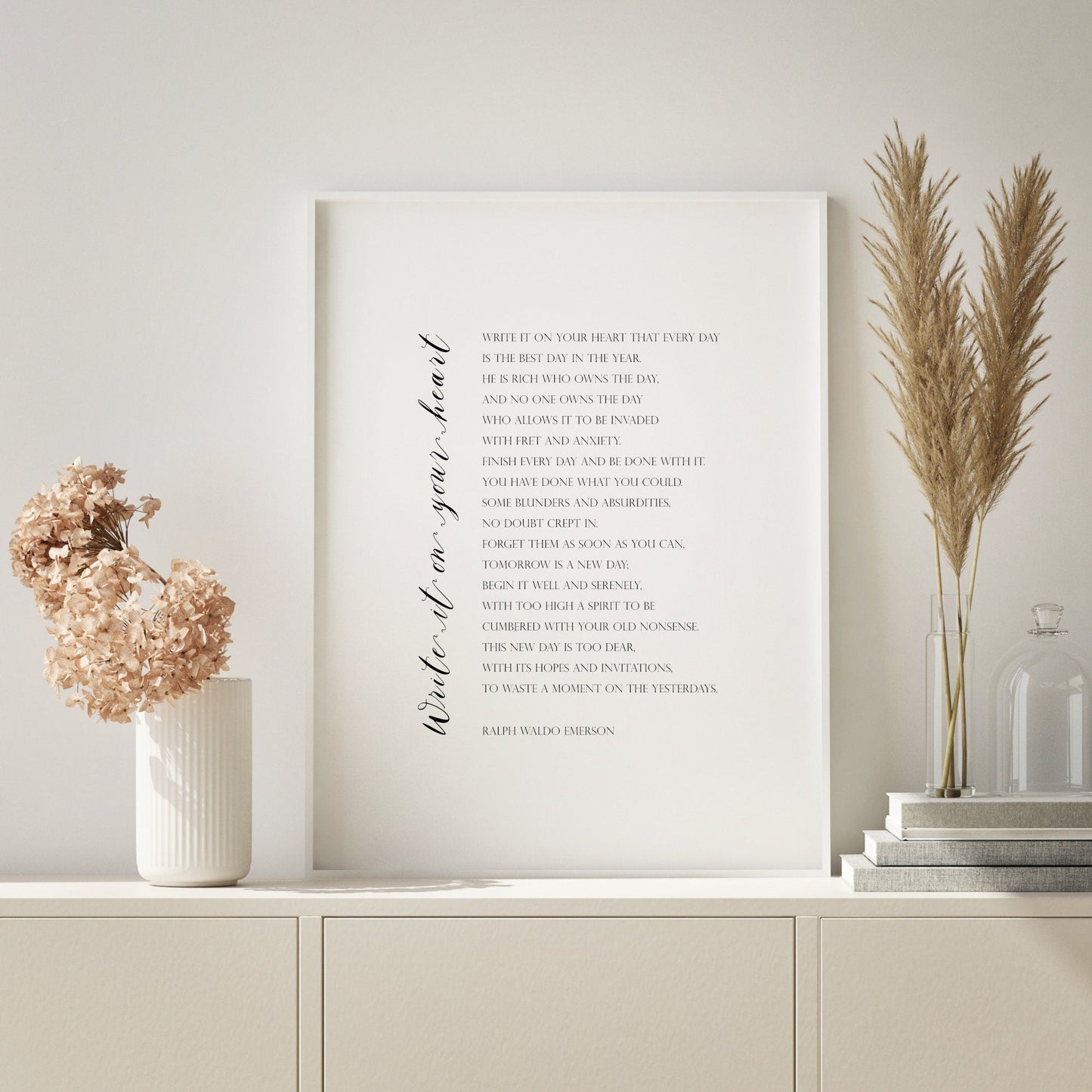 Single portrait typography print of the print "Write it on your heart" by Ralph Waldo Emerson. The title is in a script font, running vertically up the side of the poem. The body is in an upper case serif font, black on a white background.