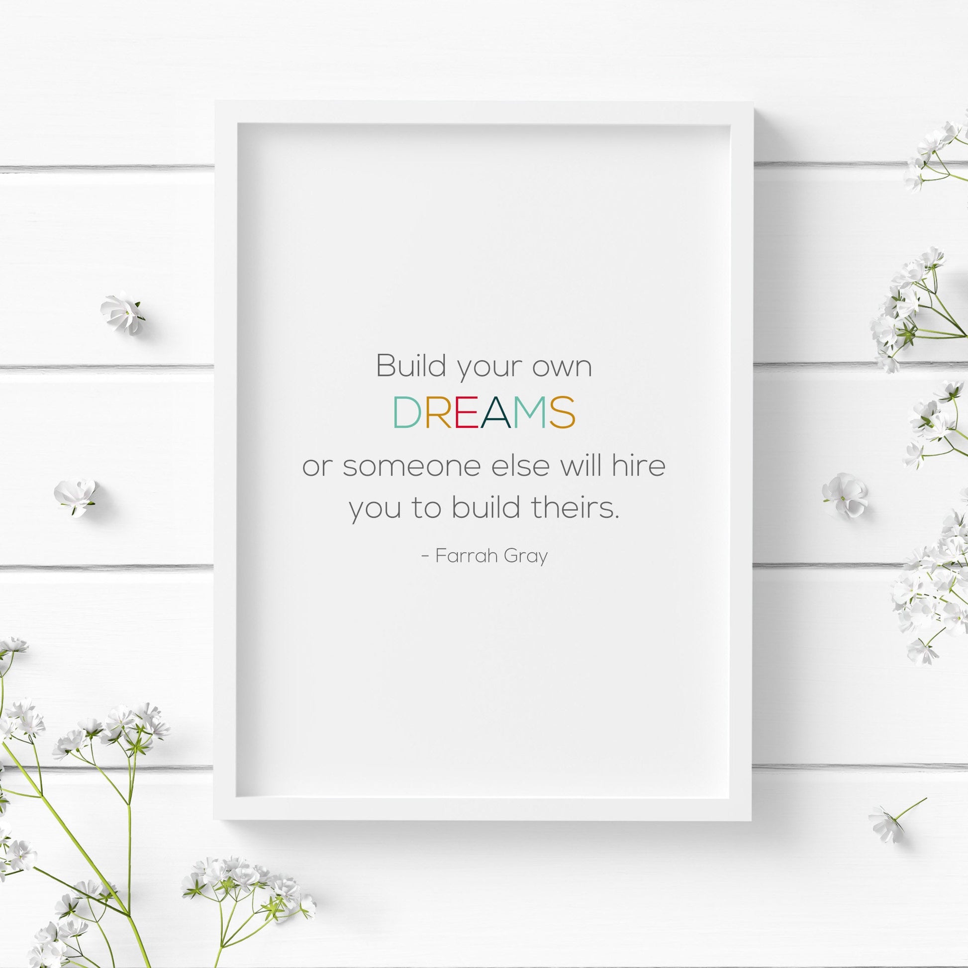 Single portrait typography print. Text reads: Build your own dreams or someone else will hire you to build theirs. This is followed by an attribution to Farrah Gray. The word dreams is highlighted in multicolour.