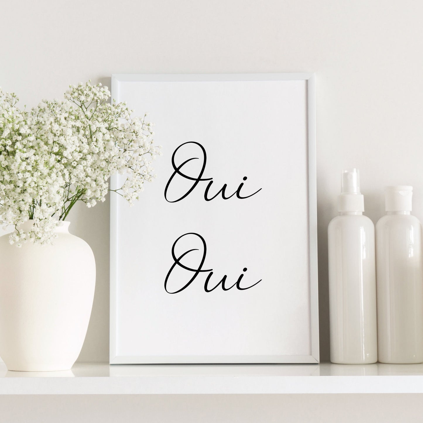 Single portrait typography print shown in a bathroom setting. Text in French reads: Oui Oui. All text is in a fun script font.