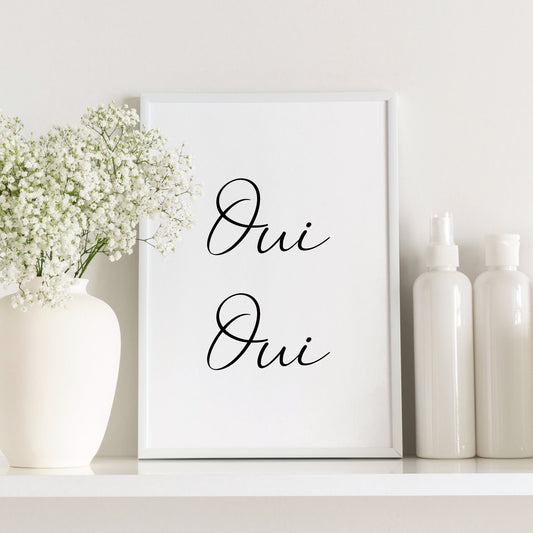 Single portrait typography print shown in a bathroom setting. Text in French reads: Oui Oui. All text is in a fun script font.