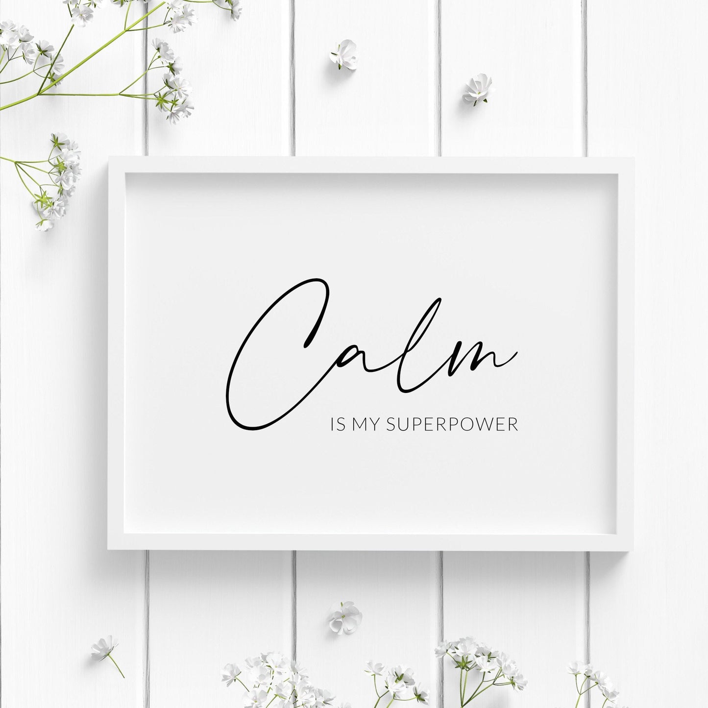 Single landscape typography print. Text reads: Calm is my superpower. The word calm is positioned prominently in an elegant script font, with the remaining text in a small upper case sans serif font. Text is black on a white background.