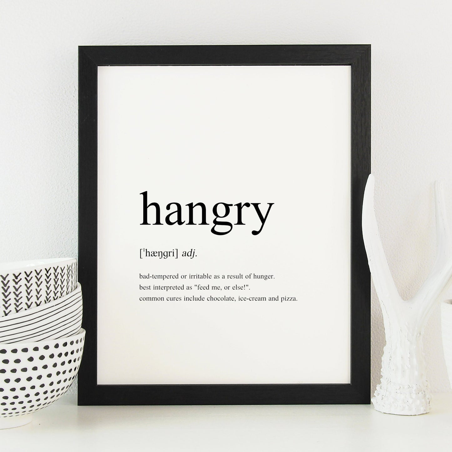 Single portrait typography print showing a humorous definition of the word hangry in a traditional dictionary-style. Text is black on a white background.